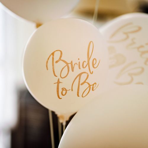 Balloons that say bride to be.